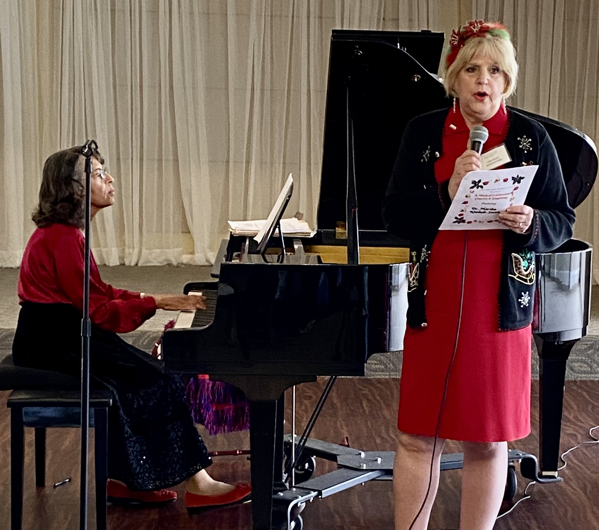 Dr Marsha Kindall-Smith played while Debi Frock led the sing along at the December Luncheon.